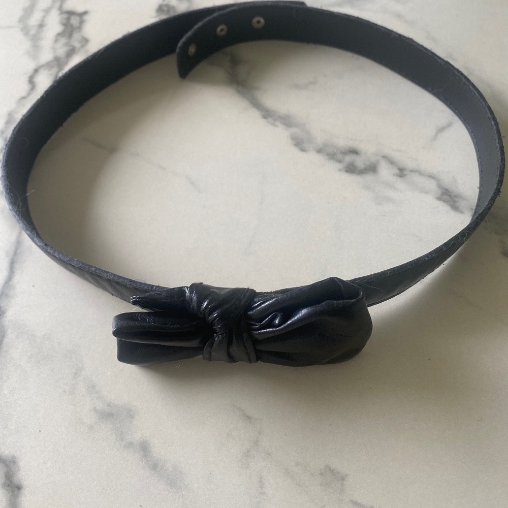 Black faux leather bow belt